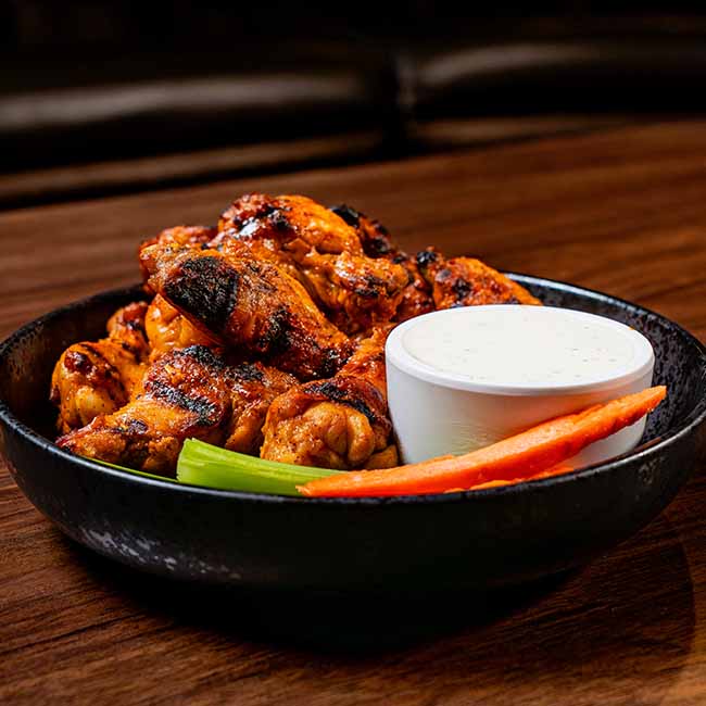 Buffalo chicken wings with ranch, celery, and carrots at a North Liberty Iowa bowling arcade.