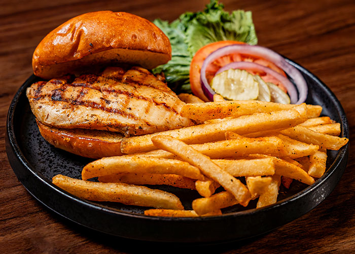 Grilled Chicken sandwich with fries from Bowldogs